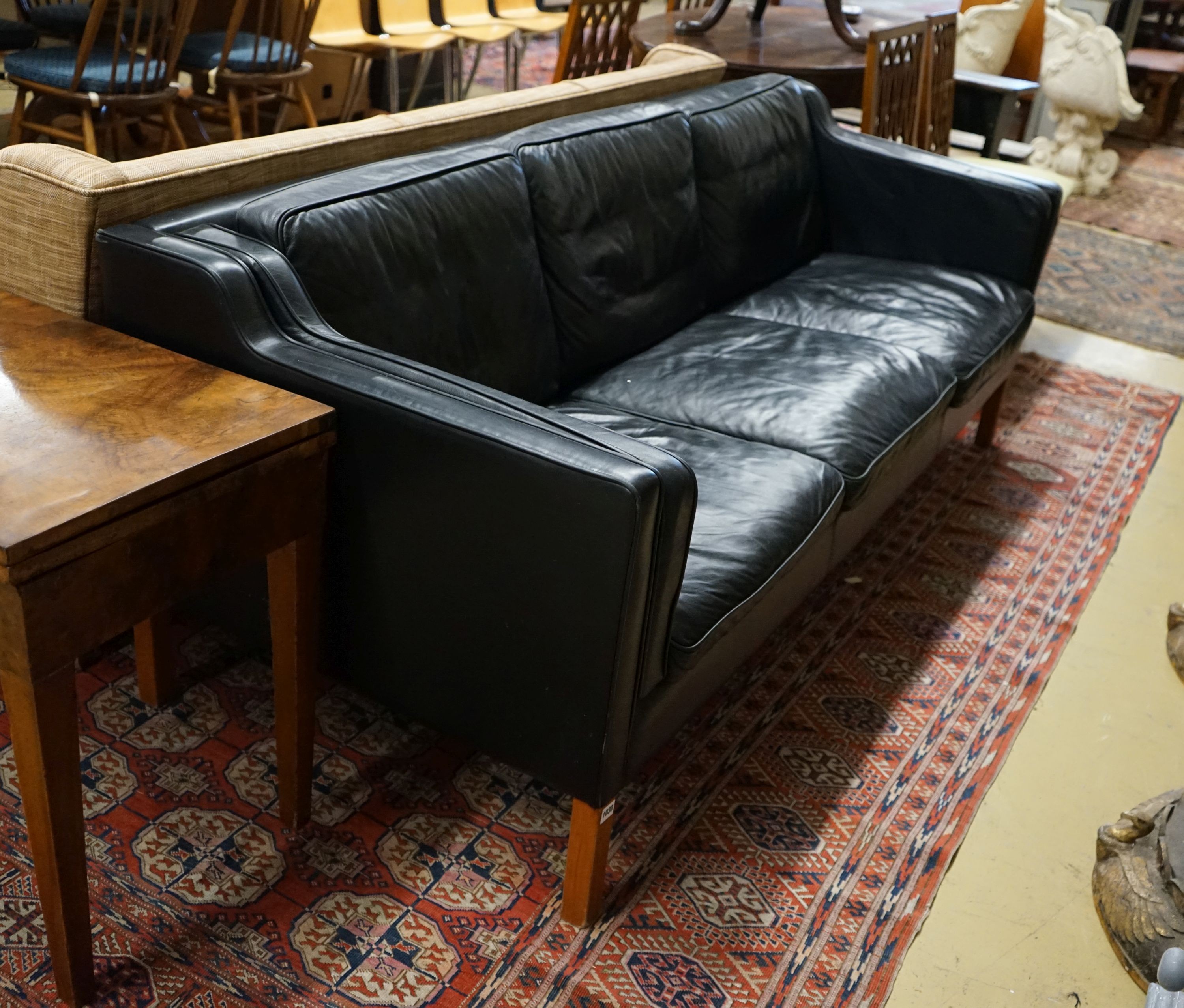 A mid century Danish black leather three seater sofa in the style of Borge Mogensen, length 201cm, depth 80cm, height 76cm